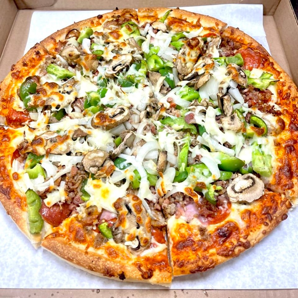 Family Style Pizza's supreme pizza, loaded with pepperoni, sausage, mushrooms, onions, and green peppers.